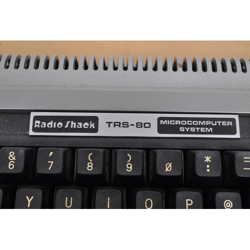 240 - Radioshack - A vintage 20th century circa 1980s Radioshack TRS-80 microcomputer. The computer in ori... 