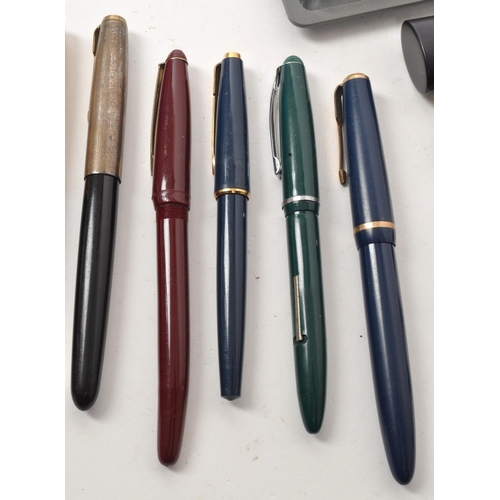 242 - A collection of assorted vintage fountain and ballpoint pens, including names such as Conway Stewart... 