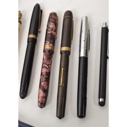 242 - A collection of assorted vintage fountain and ballpoint pens, including names such as Conway Stewart... 