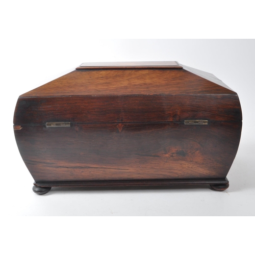 264 - A 19th-century mahogany sarcophagus tea caddy, featuring twin compartments with brass hinged, bevele... 