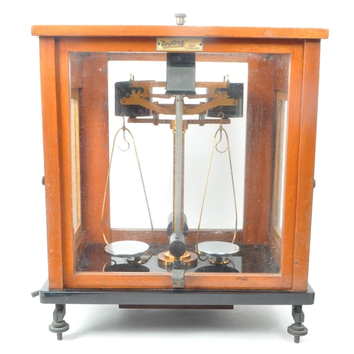 277 - L. Oertling Ltd - An early 20th century London balance scales model. 52F.M and weights, stored in a ... 