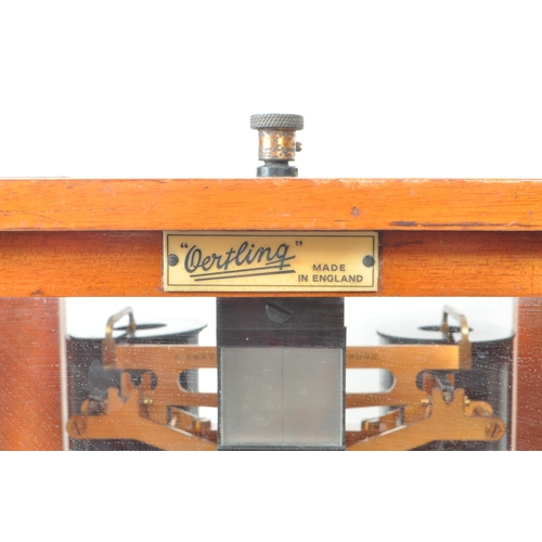 277 - L. Oertling Ltd - An early 20th century London balance scales model. 52F.M and weights, stored in a ... 