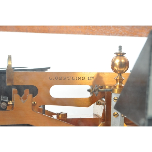 277 - L. Oertling Ltd - An early 20th century London balance scales model. 52F.M and weights, stored in a ... 