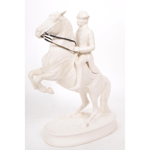 28 - A vintage 20th century white porcelain man riding a horse figure, featuring attached leather straps ... 