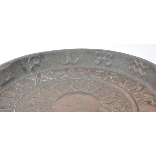 280 - An early 20th century large repousse Zodiac wall charger, with the Latin lettering 'Tempus Edax Reru... 