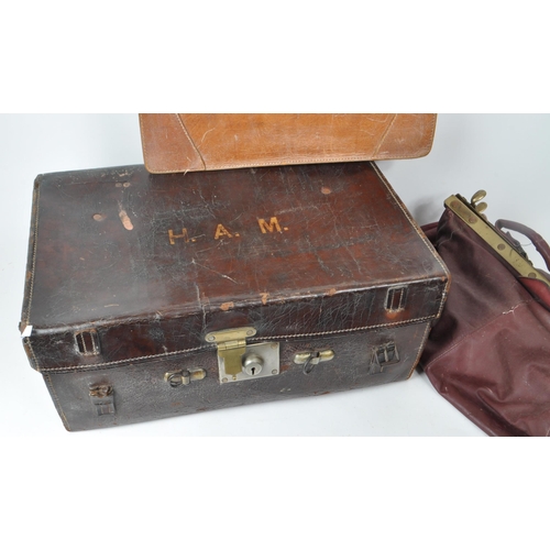 282 - Three 20th century leather bags, including a Gladstone leather satchel, a Fisher trunk / briefcase, ... 