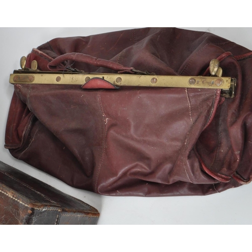 282 - Three 20th century leather bags, including a Gladstone leather satchel, a Fisher trunk / briefcase, ... 