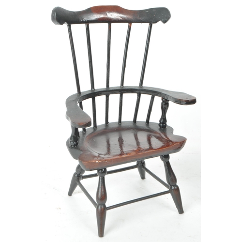 284 - A pair of 20th century paper mache combe back windsor chairs. The chairs having shaped top rail with... 