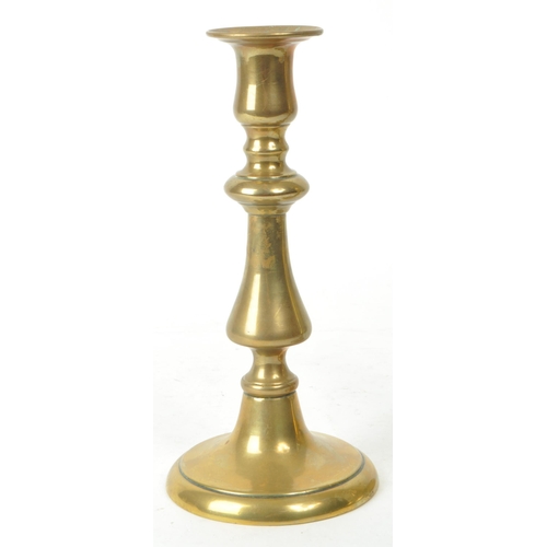 286 - A pair of early 20th century brass candlestick / taperstick holders, measuring approx. 20cm tall. ... 