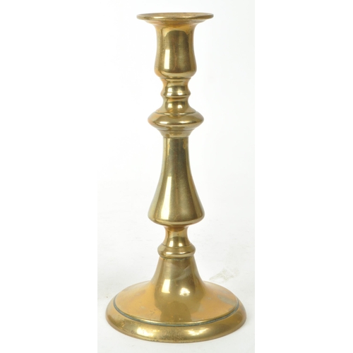 286 - A pair of early 20th century brass candlestick / taperstick holders, measuring approx. 20cm tall. ... 