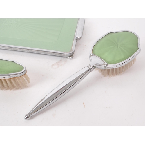 287 - A mid 20th century art deco style vanity dress set, with metal handles and Guilloche style green des... 