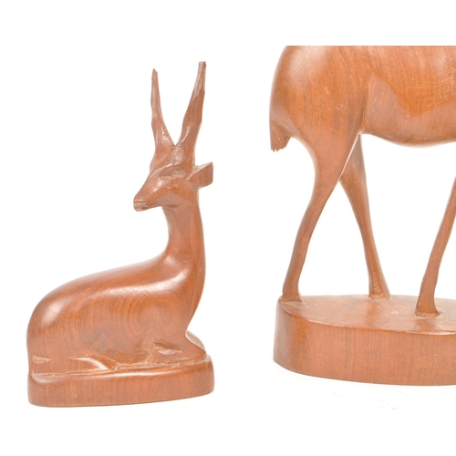 288 - Five 1960s / 1970s teak carved antelope / deer ornament sculptures, comprised of two adult antelope ... 