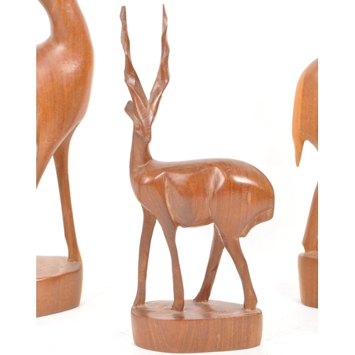 288 - Five 1960s / 1970s teak carved antelope / deer ornament sculptures, comprised of two adult antelope ... 