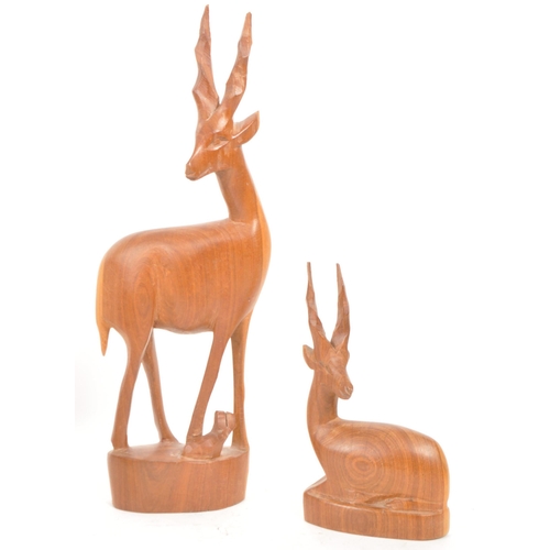 288 - Five 1960s / 1970s teak carved antelope / deer ornament sculptures, comprised of two adult antelope ... 