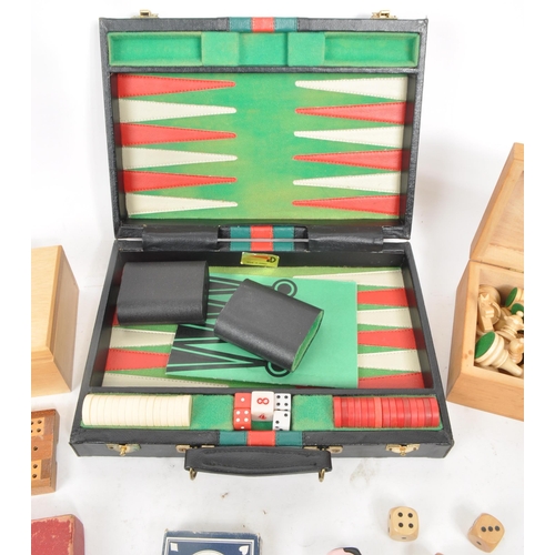 292 - A collection of assorted vintage 20th century board game pieces, comprised of a Korean backgammon br... 