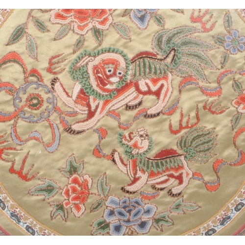 294 - A vintage 20th century Chinese embroidered silk tapestry, featuring two Chinese dragons to the centr... 