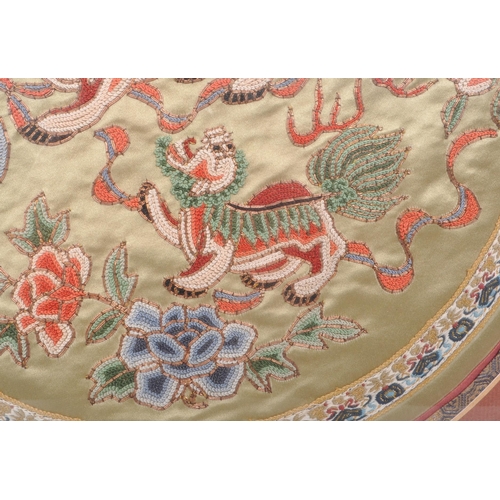 294 - A vintage 20th century Chinese embroidered silk tapestry, featuring two Chinese dragons to the centr... 