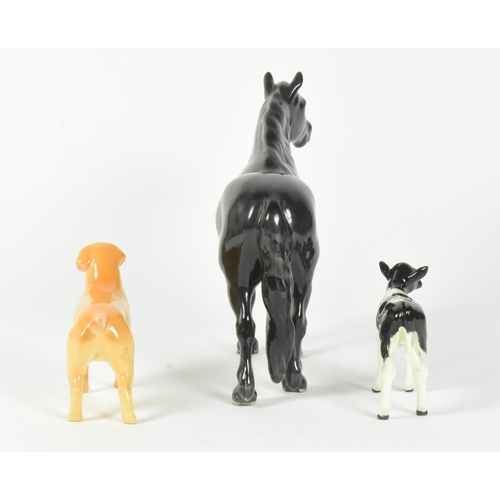 30 - Beswick - A collection of three 20th-century china porcelain animal figurines, comprising a Golden L... 