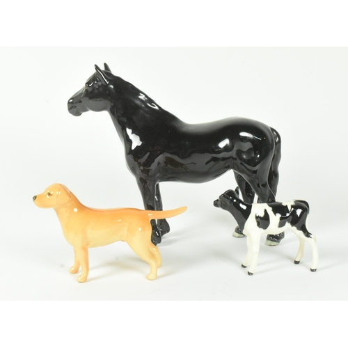 30 - Beswick - A collection of three 20th-century china porcelain animal figurines, comprising a Golden L... 