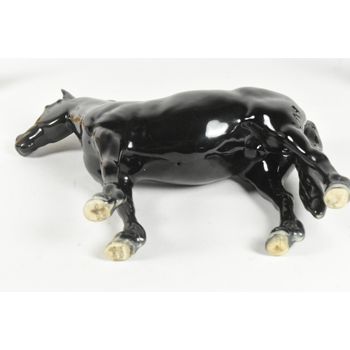 30 - Beswick - A collection of three 20th-century china porcelain animal figurines, comprising a Golden L... 