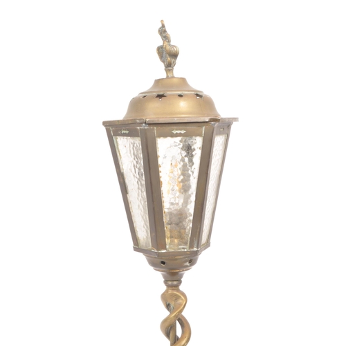 302 - A vintage early 20th century lamp post style brass table lamp, featuring six frosted glass panes for... 