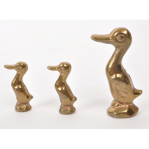 303 - Three 19th century Burmese brass opium weights. Each weight in the form of a duck. A larger one and ... 