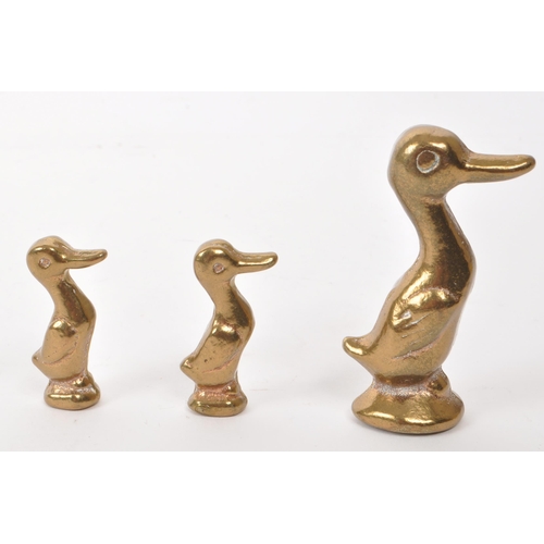 303 - Three 19th century Burmese brass opium weights. Each weight in the form of a duck. A larger one and ... 