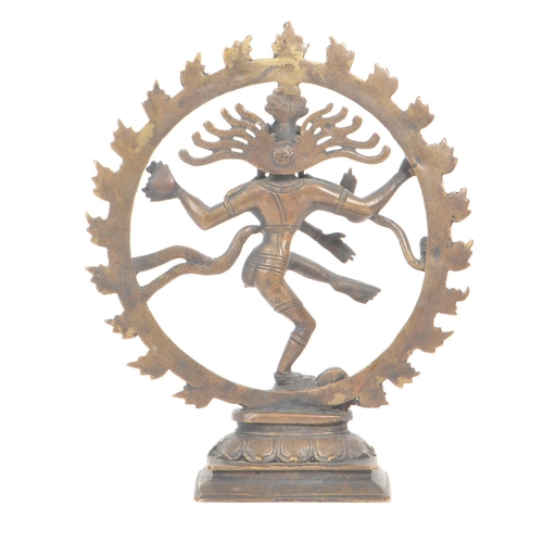 305 - A late 19th - early 20th century Indian dancing Shiva brass temple figure. The statue featuring four... 