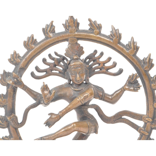 305 - A late 19th - early 20th century Indian dancing Shiva brass temple figure. The statue featuring four... 