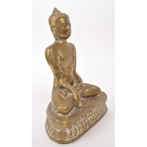 306 - An early 20th century brass Tibetan Buddha deity sculpture, depicting the figure sat crossed legged ... 