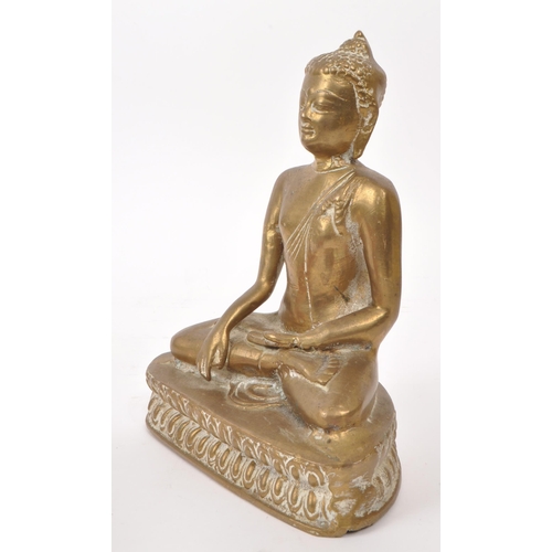 306 - An early 20th century brass Tibetan Buddha deity sculpture, depicting the figure sat crossed legged ... 