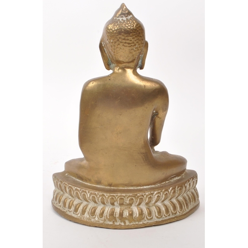 306 - An early 20th century brass Tibetan Buddha deity sculpture, depicting the figure sat crossed legged ... 