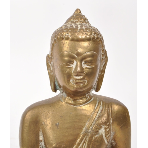 306 - An early 20th century brass Tibetan Buddha deity sculpture, depicting the figure sat crossed legged ... 