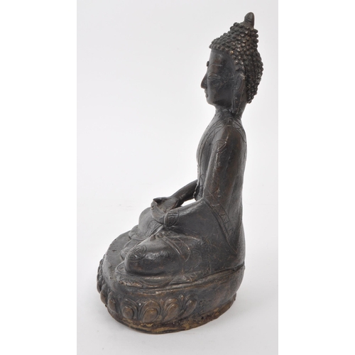 308 - A bronze 19th / early 20th century Sino-Tibetan statue of Buddha Shakyamuni. Serenity / double lotus... 