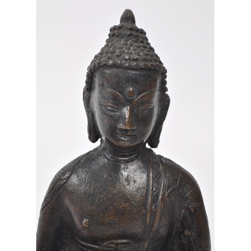 308 - A bronze 19th / early 20th century Sino-Tibetan statue of Buddha Shakyamuni. Serenity / double lotus... 