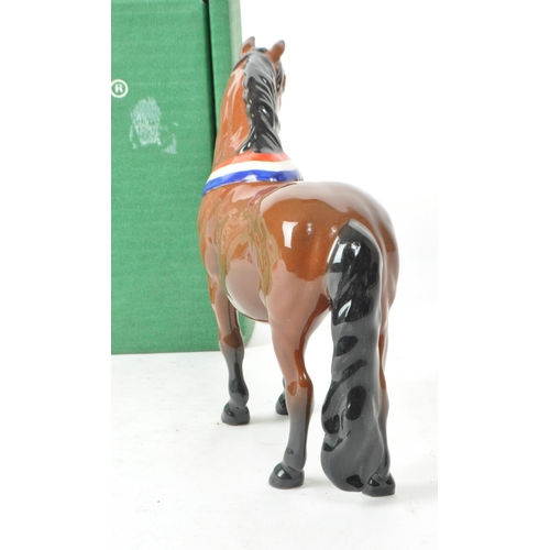 31 - Beswick - A 20th-century china brown gloss 'Another Bunch' horse. Featuring a brown horse standing, ... 