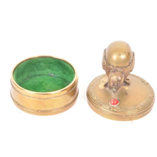 310 - Early 20th century gilt painted brass trinket box, featuring a chick and a red painted lady painted ... 