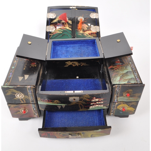 313 - 20th century Chinese lacquered jewelry and music box, with five drawers to the front and a lid that ... 