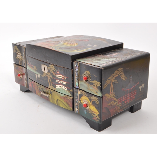 313 - 20th century Chinese lacquered jewelry and music box, with five drawers to the front and a lid that ... 