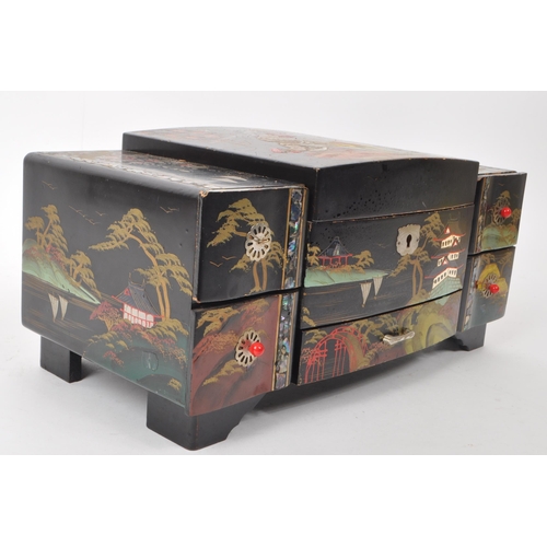 313 - 20th century Chinese lacquered jewelry and music box, with five drawers to the front and a lid that ... 