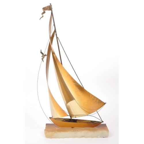 317 - John Demott - A vintage mid century brass, copper and steel sailboat sculpture, mounted on an onyx b... 