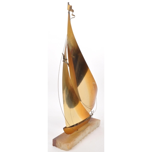 317 - John Demott - A vintage mid century brass, copper and steel sailboat sculpture, mounted on an onyx b... 