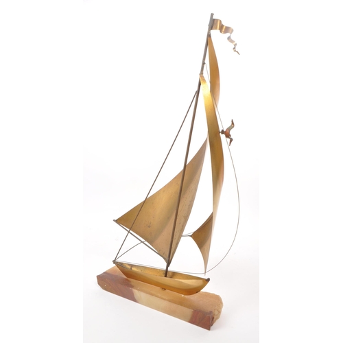 317 - John Demott - A vintage mid century brass, copper and steel sailboat sculpture, mounted on an onyx b... 