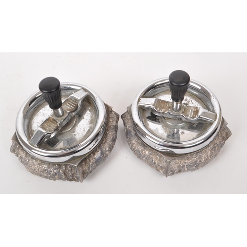 318 - Two vintage mid century Dutch silver plated zilpla 90 roulette ashtrays, featuring ornate relief dec... 