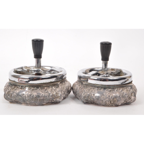 318 - Two vintage mid century Dutch silver plated zilpla 90 roulette ashtrays, featuring ornate relief dec... 