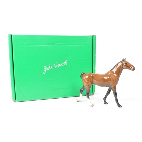 32 - Beswick - A 20th-century china brown gloss 'Hackney Pony' no. H261 figurine. Featuring a brown horse... 