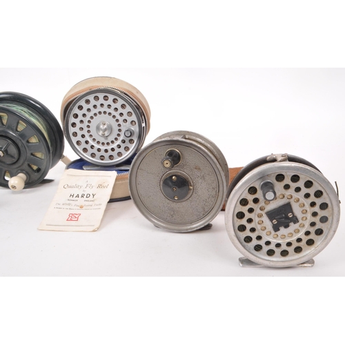 323 - A collection of eight vintage fishing reels, including examples by Beaudex, Ambassadeur 9000 (ABU), ... 