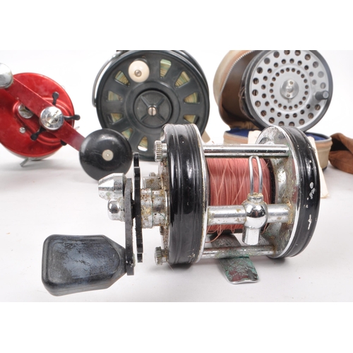 323 - A collection of eight vintage fishing reels, including examples by Beaudex, Ambassadeur 9000 (ABU), ... 