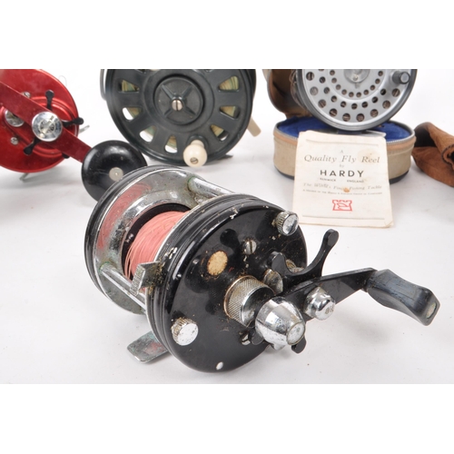 323 - A collection of eight vintage fishing reels, including examples by Beaudex, Ambassadeur 9000 (ABU), ... 