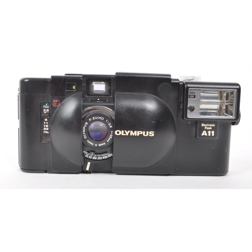 335 - Olympus - XA - A circa 1980s Olympus XA 35mm rangefinder camera. The camera in black colourway, havi... 